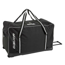 Load image into Gallery viewer, Picture of the black Bauer Core Ice Hockey Equipment Wheeled Bag (Senior)
