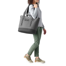 Load image into Gallery viewer, picture of women carrying the YETI Camino 35 Carryall Tote Bag