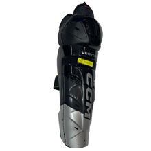Load image into Gallery viewer, CCM Hockey Shin Guards CCM Tacks Vector Source Exclusive (2023) Senior Black front side facing right
