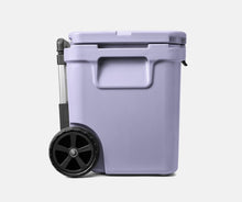 Load image into Gallery viewer, side view cosmic lilac YETI Roadie 60 Wheeled Cooler
